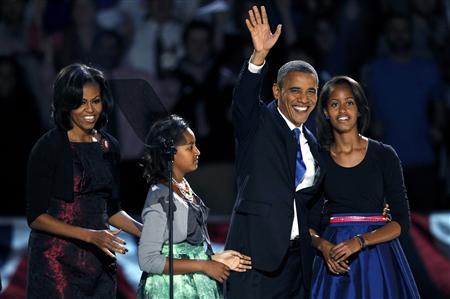 U.S. President Barack Obama walks out with his family to address supporters during his election night rally in Chicago